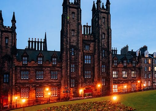 Edinburgh University with lights illuminating the building