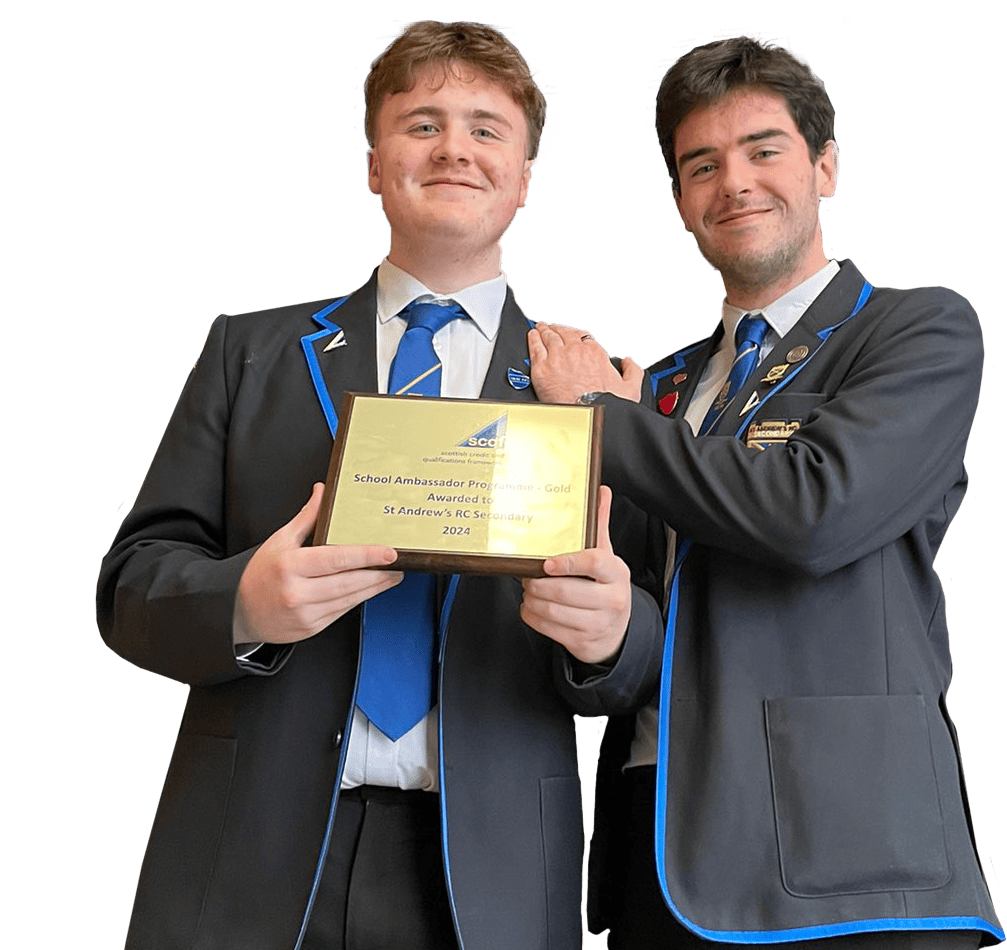Two male students from St Andrew's Secondary School, in Glasgow, wearing their uniform. One student is leaning on the other and they're both smiling. The student on the left is holding up a gold SCQF School Ambassador plaque.