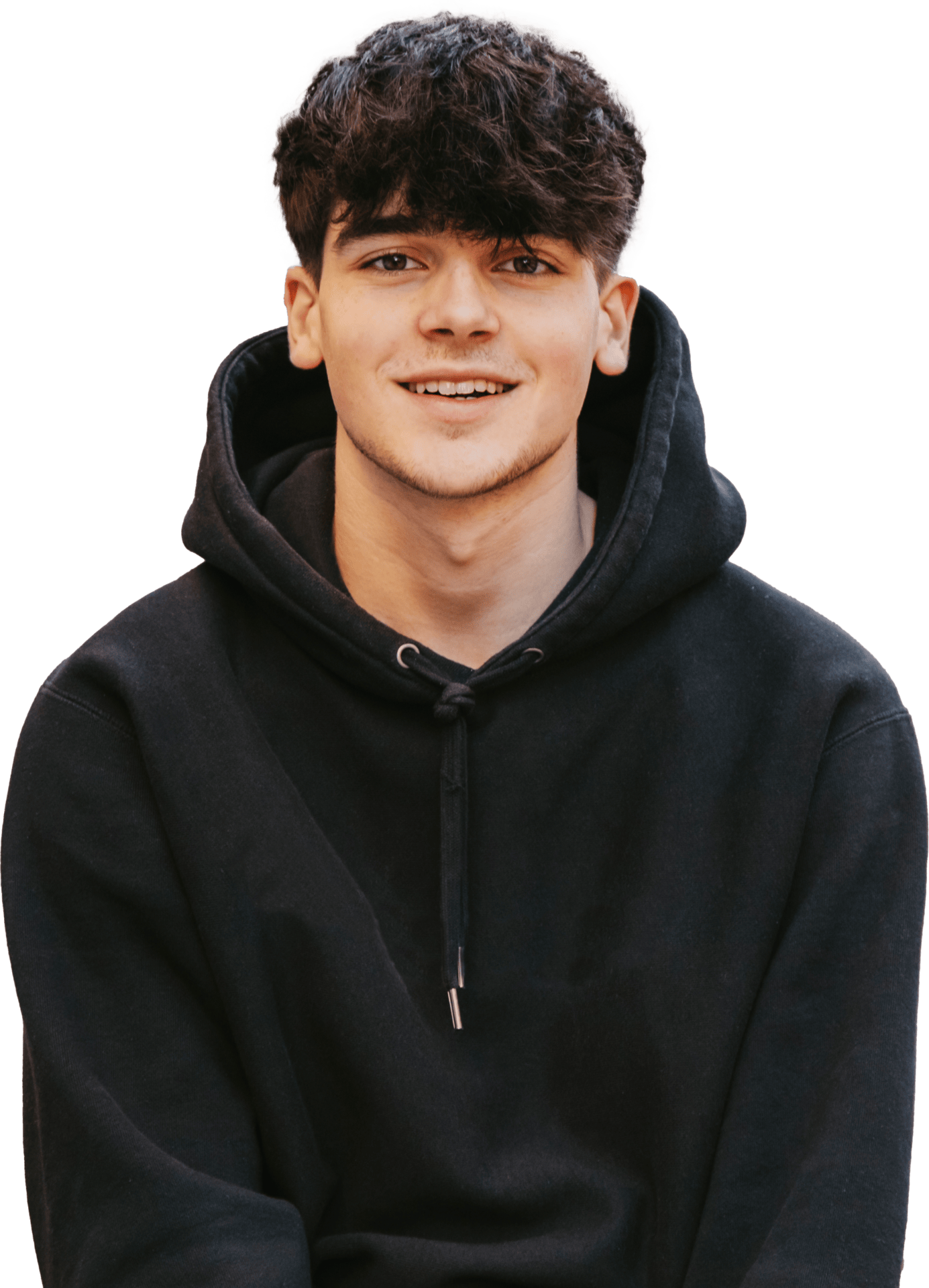 A young male learner wearing a black hooded jumper. He's smiling. He represents the school pupils that the SCQF supports.