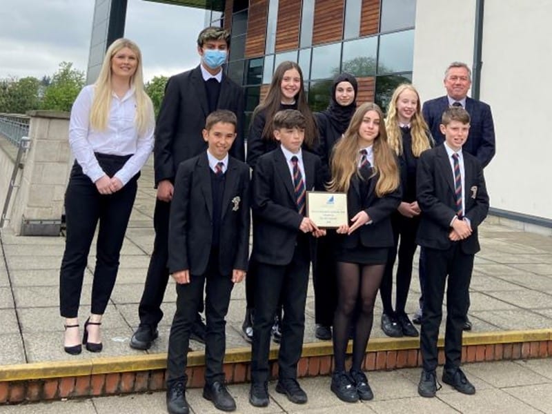 Bearsden Academy staff & pupils with gold plaque
