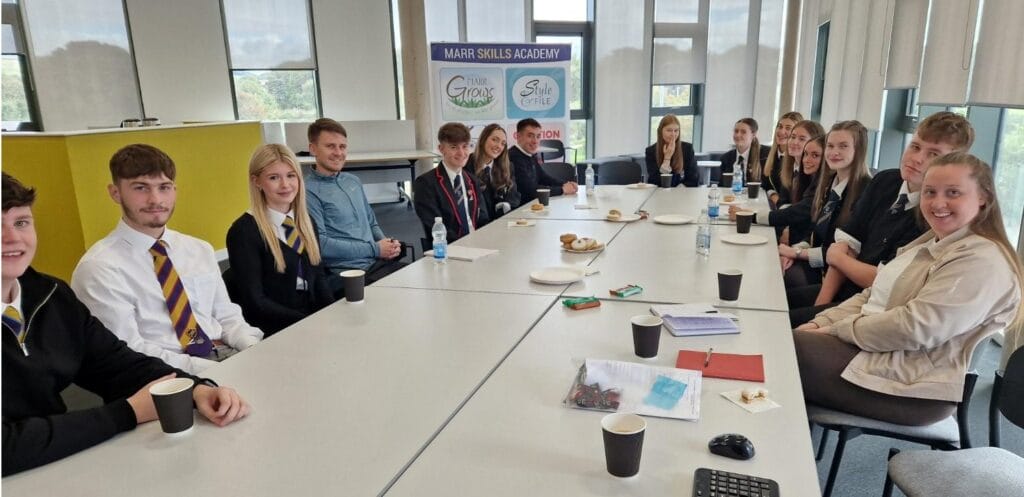 SCQF Ambassadors from Kilwinning Academy, Marr College and Queen Margaret Academy sit around a table