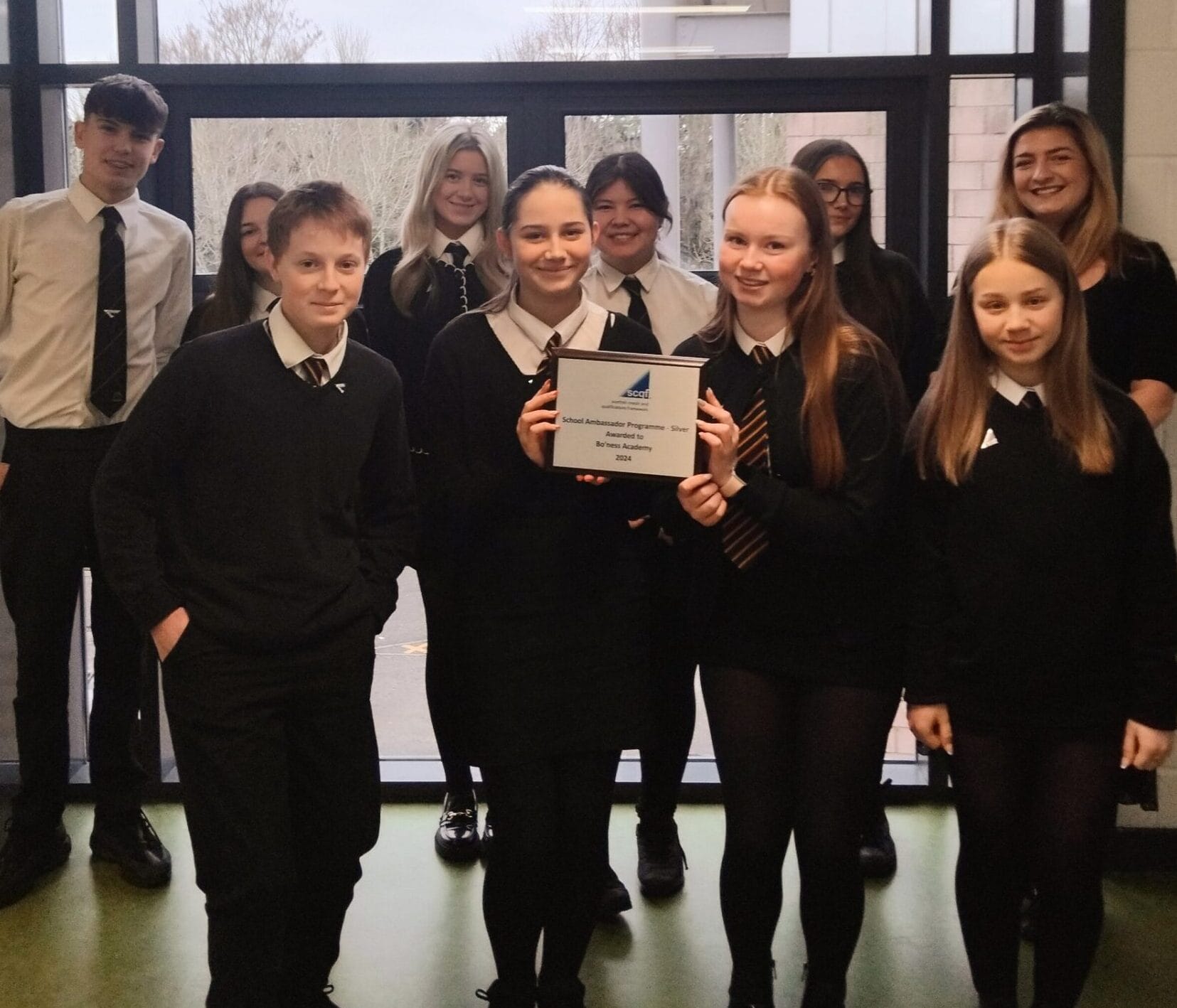 10 Bo'Ness Academy SCQF School Ambassadors pose with the SCQF Silver School Ambassador plaque